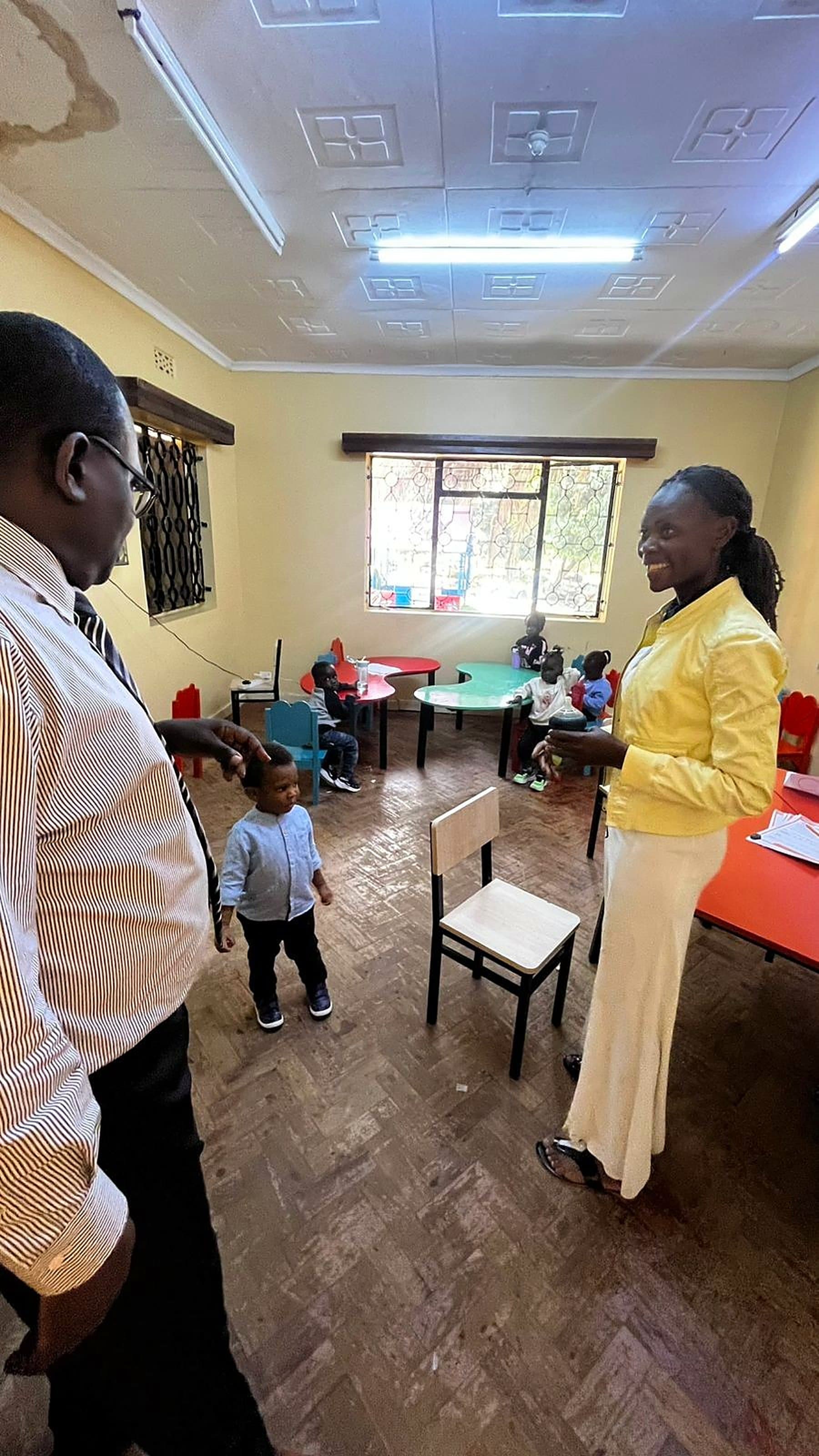 A teacher with early years children in class